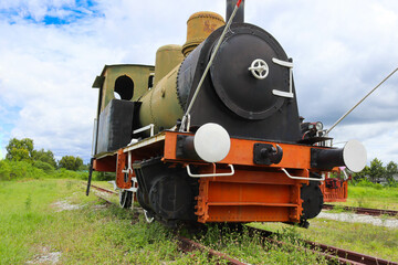 Obraz premium Antique train or ancient railway, head part are on the tracks for an industrial steam locomotive.