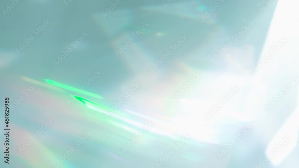 Wall mural rainbow rays of light in a prism. loop. the optical lens system creates a series of bright, changing