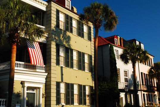 An American flag waves from a balcony of Antebellum homes in Charleston, South Carolina