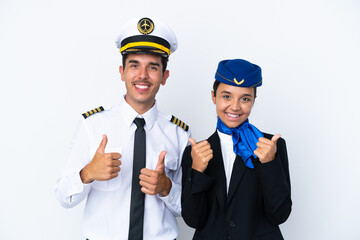 Airplane pilot and mixed race air hostess isolated on white background giving a thumbs up gesture...
