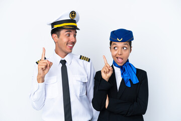 Airplane pilot and mixed race air hostess isolated on white background intending to realizes the solution while lifting a finger up