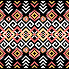 Ethnic pattern on. Black background, vector seamless pattern with yellow, pink, and white. Traditional geometric pattern design. Textile abstract pattern