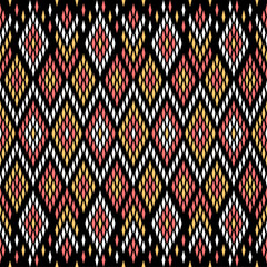 Traditional textile pattern, ethnic pattern on black background, ikat pattern 