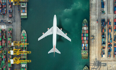 Container ship in export and import business and logistics. Shipping cargo to harbor by crane. Water transport International. Aerial view and top view.
