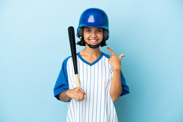 Baseball mixed race player woman with helmet and bat isolated on blue background giving a thumbs up gesture