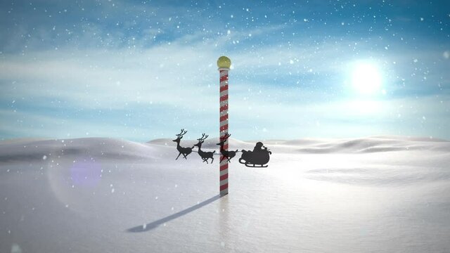 Animation of santa claus in sleigh with reindeer passing over north pole and snowy winter scenery