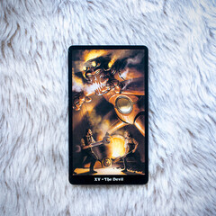 Tarot card the Devil on fur background, fortune telling and predictions