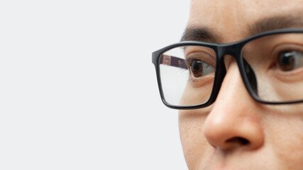 Portrait of a young man with eyeglasses isolated on white background.