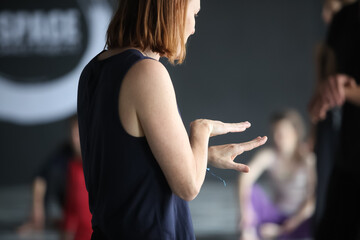 hand gesture Leading teach dancers to move technic in contact improvisation blurred intentionally...