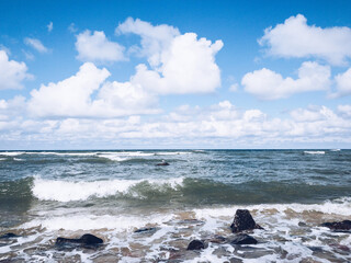 vivid seascape, beautiful sea with waves and blue sky with white clouds, natural background
