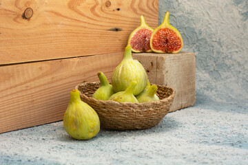 Sliced fresh figs in wooden box 