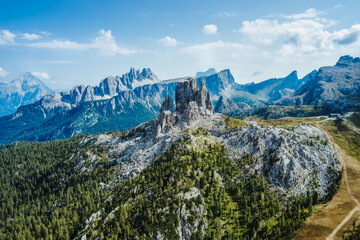 Aerial view of Cinque Torri in Dolomites mountains in Italy. Epic landscape on a sunny day of summer