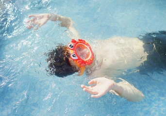 child in the pool. Summer. Security. Child under water. 