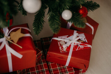 christmas gifts in red paper with postcard