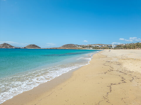 Sandy beach calm sea at Mykonos island, Cyclades Greece. Space, card, advertisement template.