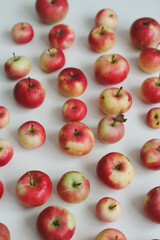 autumn background with fresh red apples on white top view