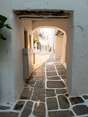 Stoa with shelter and arch over at Naousa village, Paros island, Greece. Vertical
