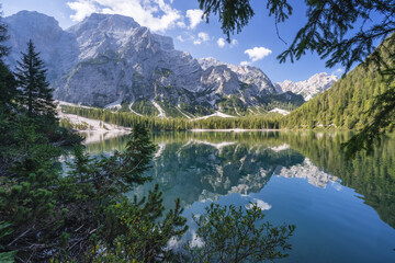 Fototapeta na wymiar Pragser Wildsee and reflected mountains in the Dolomites in Italy