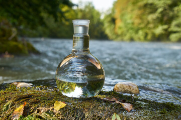 Flask with clear river water.