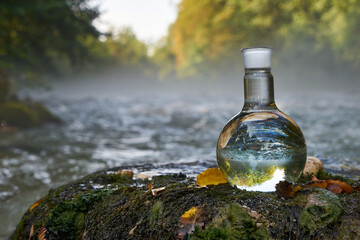 Flask with clear river water.