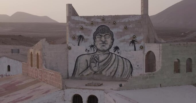 Buddha painting, Hippy Village in the desert, Mad Max set, abandoned town