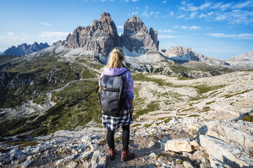 Woman hiker exploring Tre Cime di Lavaredo national park. Trentino-Alto-Adige, Dolomiti, Italy