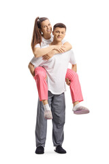 Guy in pajamas carrying a girl on a piggyback