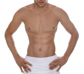 Fototapeta premium Shirtless man with slim body and towel wrapped around his hips isolated on white, closeup