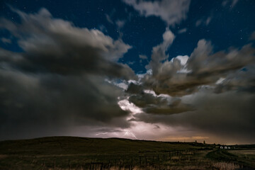 Obraz na płótnie Canvas A night thunderstorm over the prairies.
