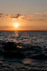 Photo of a Summer Sunset on the Lake. Travel location of popular tourist outdoor. View of beautiful Sea Landscape. Relax vacation near water