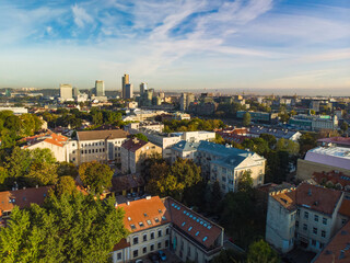 Fototapeta premium Beautiful Vilnius city panorama in autumn with orange and yellow foliage. Aerial evening view.