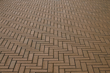 Yellow block pavior driveway. Seamless texture of street tiles. Pattern of yellow sidewalk tiles. Paved path pattern, brick path road. Cobblestone textured detailed ground concrete pavement
