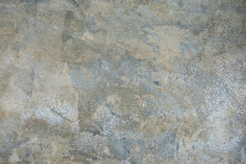 Plastered grey wall surface as a seamless background.