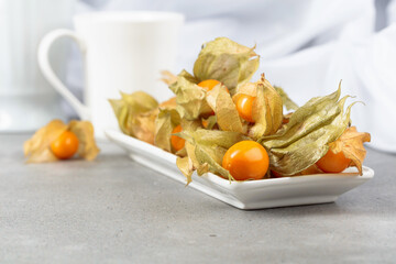 Physalis in a white dish.