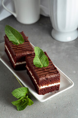 Chocolate cake garnished with mint.