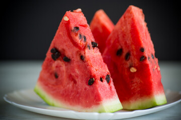 pieces of fresh ripe red watermelon on table