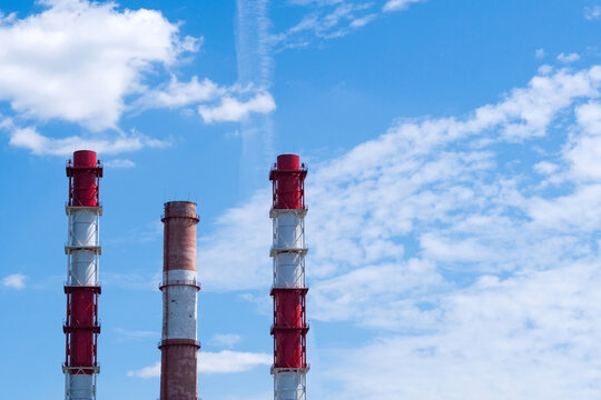 No smoke from industrial pipes close up. against the blue sky. space for text
