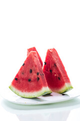 pieces of fresh ripe red watermelon on white