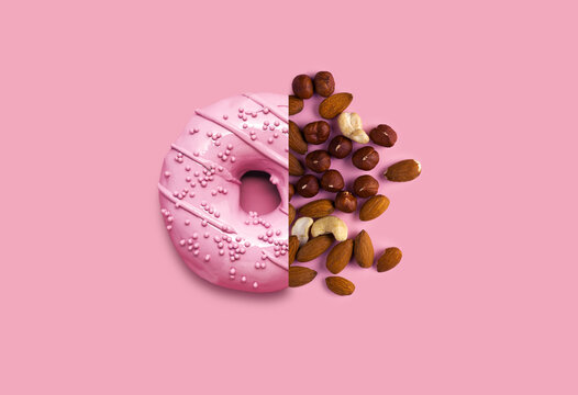 Creative food diet concept photo of donut with almond nuts.