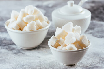 cube sugar in a white ceramic bowl