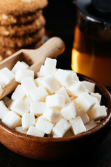 cube sugar in a wooden bowl