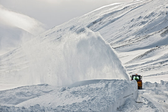 Snow plough clearing a mountain pass in north Iceland