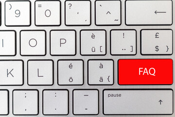 The keyboard shows red button concept for FAQ Frequently Asked Questions