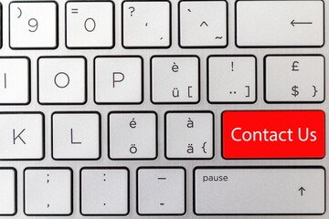 The keyboard shows red button concept for Ccontact Us