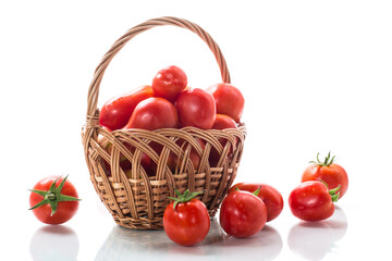 fresh ripe red tomatoes in basket isolated on white