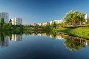 Summer sunset view of Yuzhnoe Butovo park in South Butovo district, Moscow, Russia.
