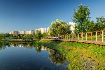 Fototapeta na wymiar Summer sunset view of Yuzhnoe Butovo park in South Butovo district, Moscow, Russia.