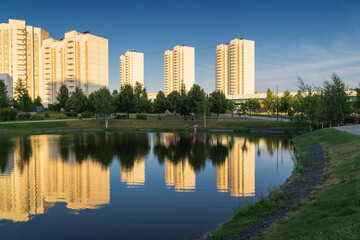 Fototapeta na wymiar Summer sunset view of Yuzhnoe Butovo park in South Butovo district, Moscow, Russia.