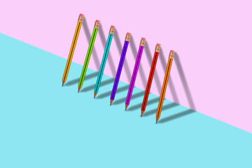 Modern and creative layout with pencils in different colors.