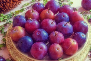 Naklejka na ściany i meble Close-up image of a juicy and fresh homemade plum